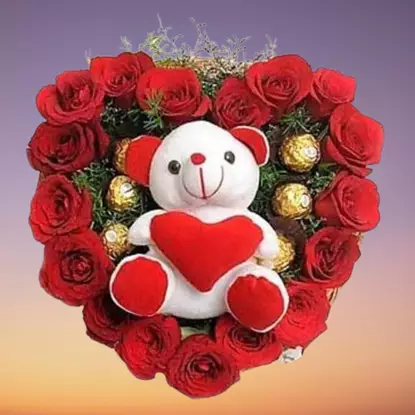 A heart shaped 50 red roses with cute teddy bear
